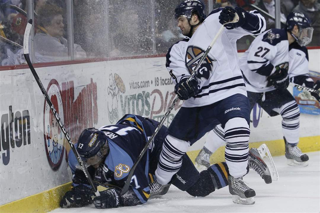 Toledo-Walleye-player-Kyle-Rogers-17-is-knocked-to-the-ice