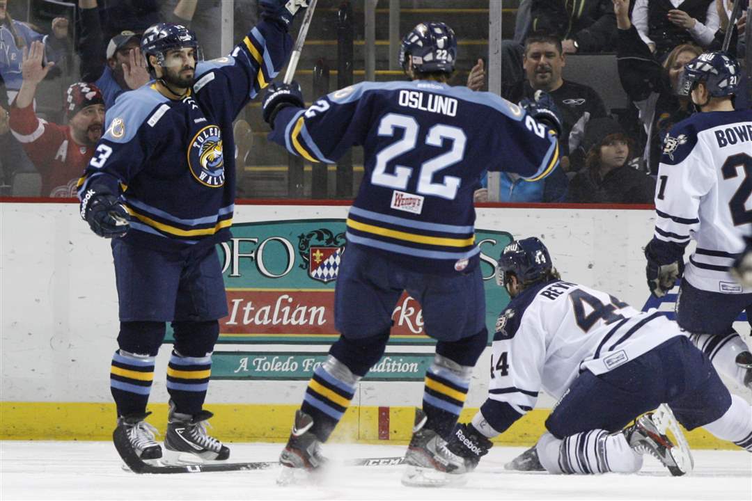 Toledo-Walleye-players-Jeremy-Tucker-13-and-Nick-Oslund-22-celebrate