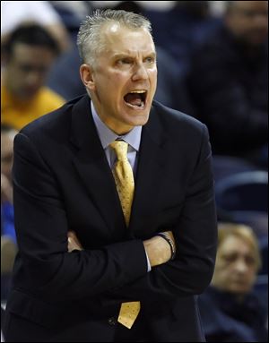 Tod Kowalczyk shouts orders to his young Rockets during a recent game.