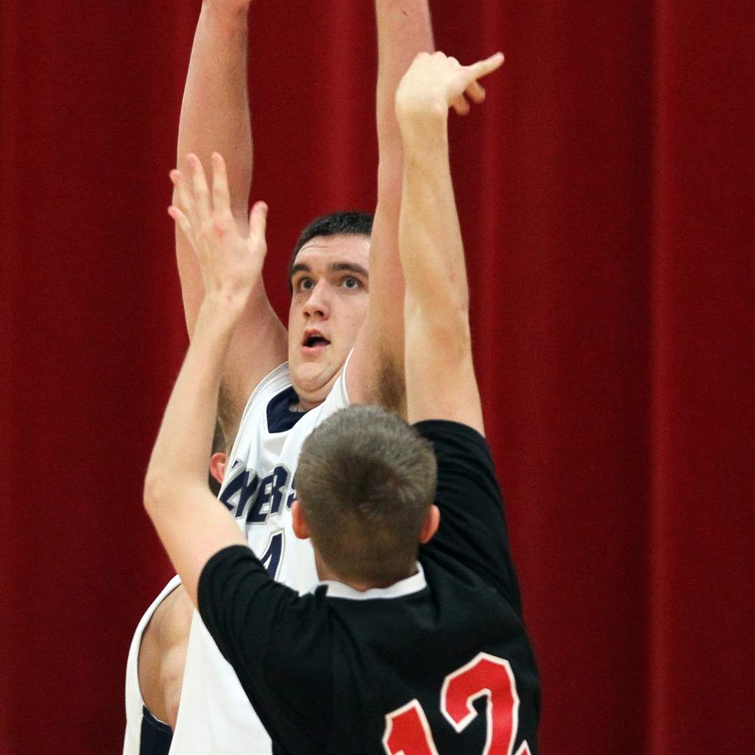 Lake-s-Marcus-Pierce-blocks-a-shot-by-Fostoria-s-Tyler-Layton