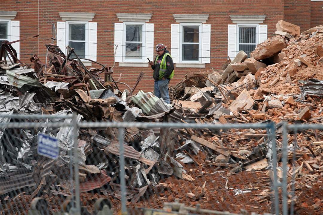 Seneca-Courthouse-rubble-worker