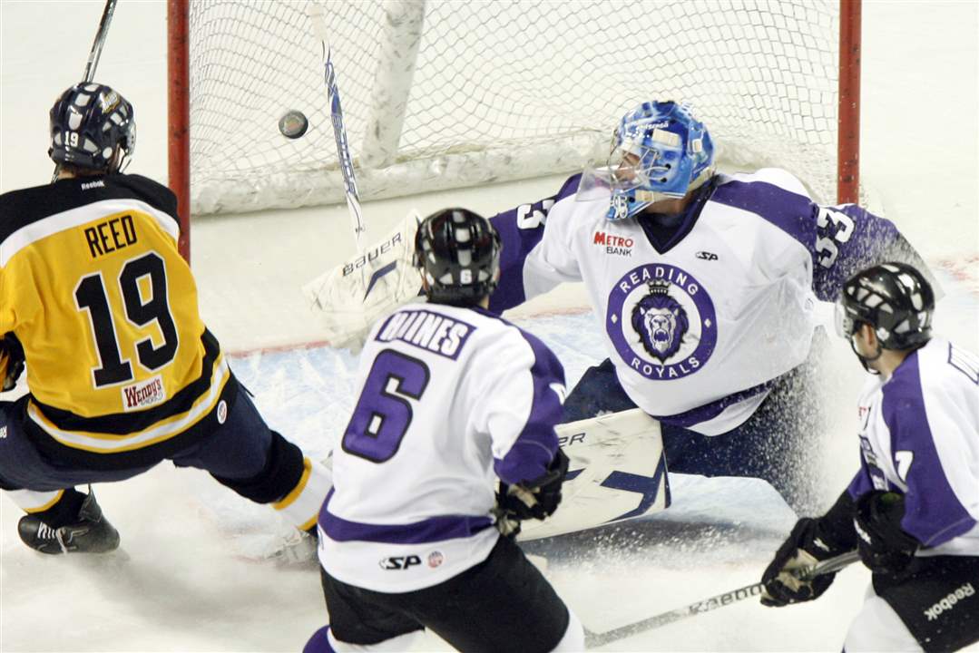 Toledo-Walleye-player-Harrison-Reed-gets-the-puck-past-Reading-goalie-Jussi-Rynnas