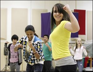 Laurel Lovitt practices a dance move with fellow members of America's Pride at Christ Presbyterian Church near Westfield Franklin Park Mall in Toledo. The Toledo chapter's weekly meetings regularly draw 30 to 40 people ages 13 to young adulthood.