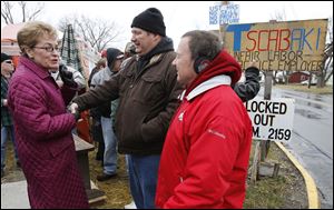 Above left, Marcy Kaptur talks with brothers Larry Lippert, a locked-out machinist at the U.S. Tsubaki plant in Sandusky, and Elmer Lippert after the debate.