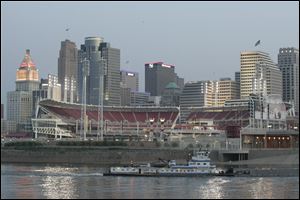 Great American Ballpark, home of the Cincinnati Reds, shines in front of the downtown skyline along the Ohio River. With 2.1 million residents, Cincinnati has Ohio’s largest metro area.