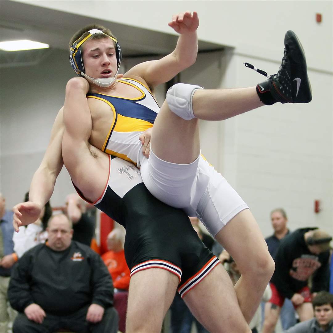 Achbold-s-Austin-Ripke-is-taken-by-Seneca-East-s-Nick-Hughes-during-the-160-pound-match