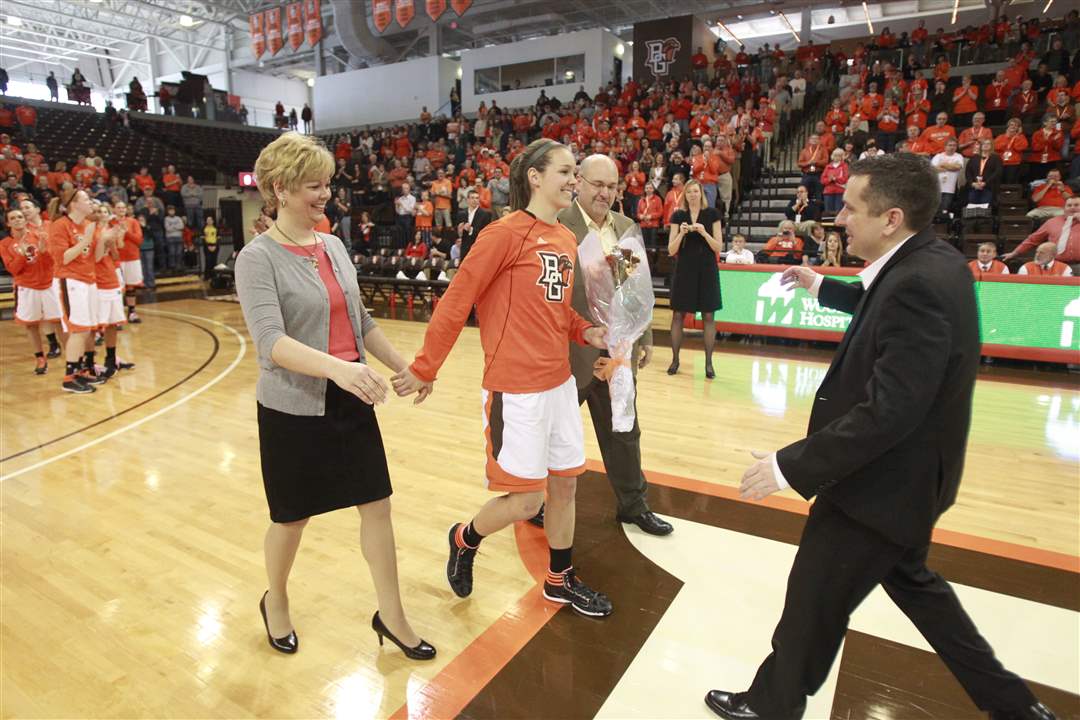 Bowling-Green-senior-Jessica-Slagle-with-parents-Sue-and-Dave-Slagle-is-greeted-by-coach-Curt-Miller