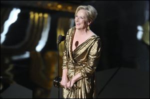 Meryl Streep accepts the Best Actress award for her role as Margaret Thatcher in the 