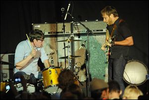 The Black Keys perform onstage at Chinatown’s Historical Central Plaza in Los Angeles.