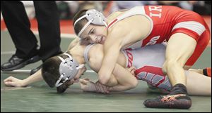 Central Catholic's Nate Hagen, top, won at 120-pounds over Dover's Isaac Hammonds.