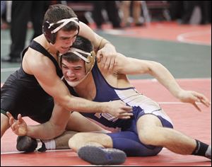 Oak Harbor's Alex Bergman, left, was beaten by Tiffin Columbian's Seth Williams 5-2 in the 152-pound third-place match on Saturday in the Division II state championships at Value City Arena in Columbus.