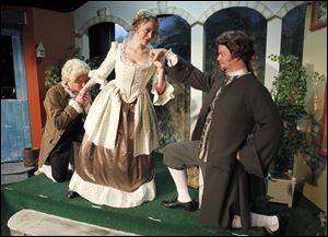 The cast of the Village Players' production of 'School for Husbands' rehearses for this weekend's opening. From left are J.P. Welch, Emily Larson, and John DuVall.