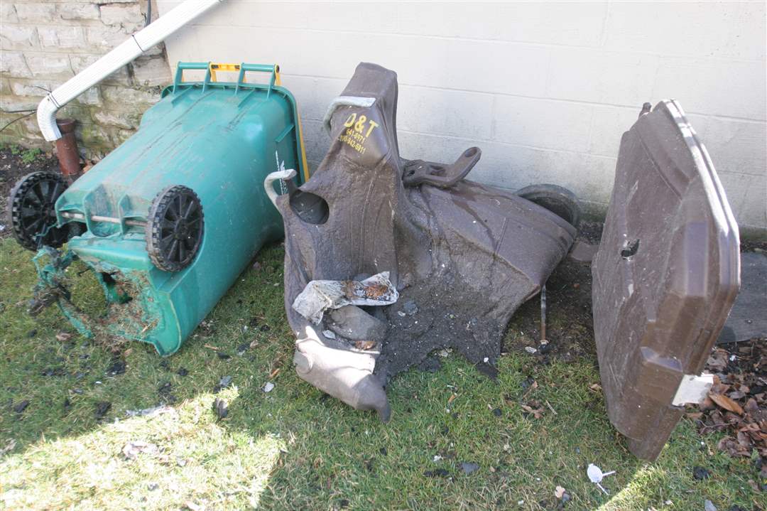 Melted-garbage-cans-across-the-street-from-the-massive-church-fire-in-Ada-OH