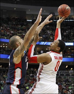 Jared Sullinger shoots over Gonzaga's Robert Sacre. Sullinger scored 18 to lead the Buckeyes to a regional semifinal on Thursday.