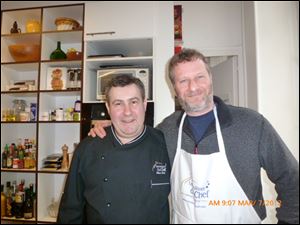 Dan Neman smiles with chef Olivier Berte.