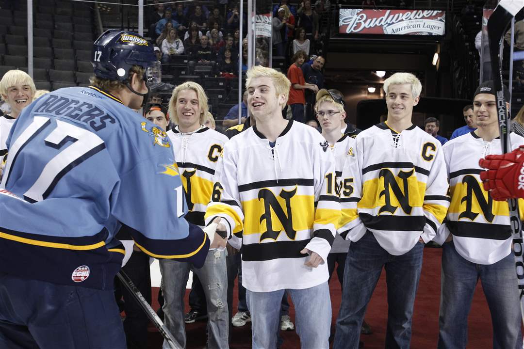 Sylvania-Northview-player-Brad-Wadsworth-shakes-hands-with-Toledo-Walleye-captain-Kyle-Rogers