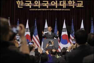 President Barack Obama arrives to speak at Hankuk University in Seoul, South Korea. Obama discussed his Prague agenda to stop the spread of nuclear weapons and seek the peace and security of a world without them.