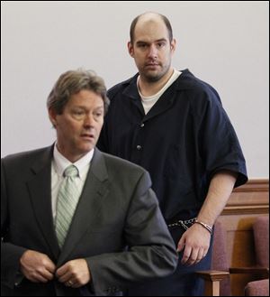 Kevin Wolever, with attorney George Gerken, left, appears in Lucas County Common Pleas Court and is sent to the Northwest Ohio Psychiatric Hospital. A former fire inspector, Wolever was found not guilty by reason of insanity March 16 to charges linked to three assaults on area fire houses.