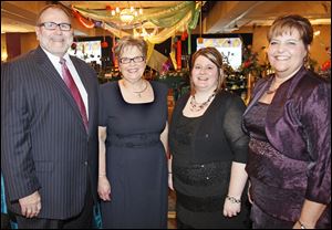 Kent Meyers at the Crystal Ball for St. Charles Hospital with event chairmen Holly Meyers, Jamie Tooman, and Amanda Caldwell.