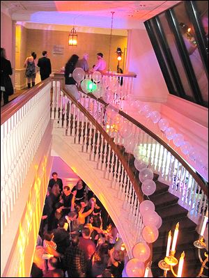 The staircase connecting the top two floors of One SeaGate was decorated to emphasis the dramatic lighting.