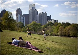 In Atlanta,  March's warmth brought out loungers and frolicking children. Scientists say global warming, helped by a La Nina weather pattern, helped the first quarter of 2012 break the record by 1.4 degrees.