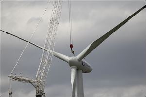 An worker on the wind turbine as it is installed in Oregon at Clay High School.