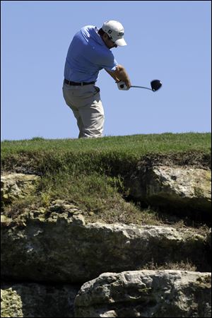 Ben Curtis hits his drive on the 12th hole during the third round of the Texas Open golf tournament, Saturday, in San Antonio.