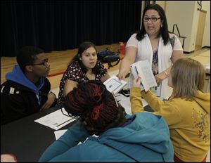 Tammy Enriquez of Adelante looks forward to reading Jeanette Walls' 'The Glass Castle' with, clockwise from her left, Amber Oberhaus, Miya Townsend, Michael Spencer, and intern Natalie Guzman. 