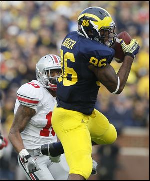 Kevin Koger had 23 catches for 244 yards and four touchdowns last season for the Wolverines.