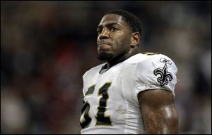 New Orleans Saints linebacker Jonathan Vilma watches the action from the sideline during the fourth quarter of an Oct. 30, 2011, football game against the St. Louis Rams in St. Louis.