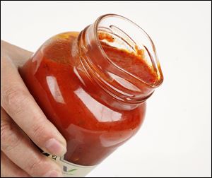 A new jar developed by Owens-Illinois.  It is being tested on jars of marinara being sold by Churchill's Market. The mouth of the jar is not round so the contents can be poured with less mess. 