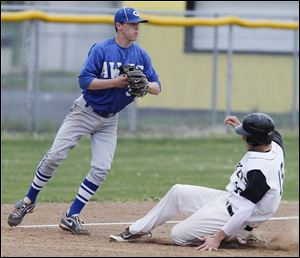 Anthony Wayne's Jake Chipka makes a play as Perrysburg's Hunter Smith slides into third base. Chipka is hitting .310 and is 7-0 on the mound with a 0.42 ERA.