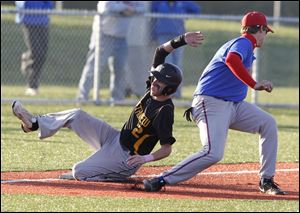 Northview's Donnie Nagle (2) steals third base past St. Francis' Jimmy O'Shea on Thursday. The Wildcats will play the Cougars for the district crown next Thursday.