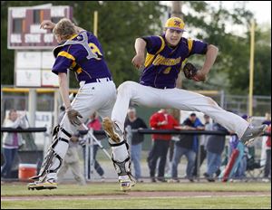 Maumee pitcher Steve Duby, right, celebrates his no-hitter against Perrysburg with catcher Brad Cousino during the Division I sectional final on Thursday. The Panthers beat rival Perrysburg 4-0.