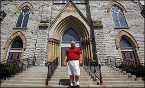 Former parishioner Norb Kirian, on the steps of St. Hedwig Church, says, ‘They are closing all of the positive things in the neighborhood.’