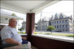 Burt Wade, who has a view of St. Hedwig Church from the porch of his home along Bronson Street, says the structure is a landmark. He said he worries its closing will contribute to blight in North Toledo’s Polish Village. Parishioners were told Sunday the church would close.