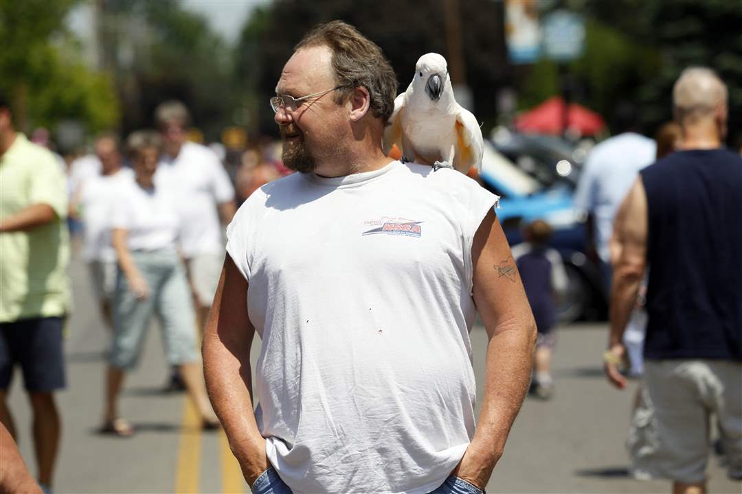 Norman-Small-walks-down-main-street