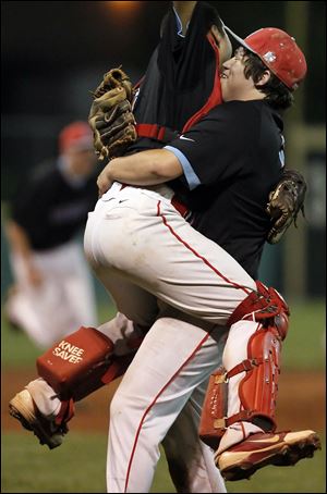 Bowsher pitcher Jake Almanza, right, celebrates winning the City League baseball championship game with catcher Reid Puligandla on Tuesday at Bowman Park.