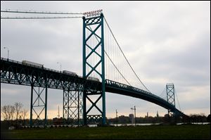 Michigan and Canadian officials continue to work to approve construction of new bridge to connect Detroit, Mich. and Windsor, Canada.