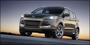 The 2013  Ford Escape looks nothing like the model that first went on sale 12 years ago.  It has the sloped aerodynamic roof and lines of the Focus sedan on which it's based.