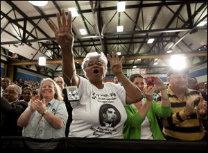 Chanting 'Four more years,' an enthusiastic crowd of about 1,500 people greets the President during a campaign stop at Cuyahoga Community College. Mr. Obama boasted Thursday that the economy has created 4.2 million jobs since he became President.