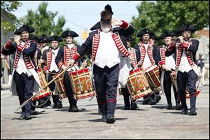 Bob DuFour leads the Kentish Guards of  East Greenwich, R.I., at the sixth annual National Fife and Drum Muster. The first Michigan Colonial Fife and Drum Corps in Monroe was host for Saturday's event.