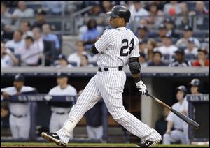 The Yankees' Robinson Cano hit a home run and had three RBIs as New York battered the Cleveland Indians on Monday night.