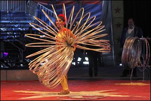 Jacqueline Coronel of Peru spins multiple hoops in her act during the two-hour circus show.