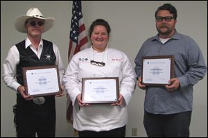 From left, Danny Ives, Woodville, Ohio; Sherry Letzelter, Lodi, Ohio, and Dustin Hostetler, Toledo, Ohio, hold their awards from the Center for Innovative Food Technology as part of the fifth annual Food Product Development Contest. Ivy was recognized for his Nacho Danny's Kinda Hot, Hot Sauce; Letzelter was given the award for her Pumpkin Seed Trail Mix, and Hostetler was recognized for his Poppy Seed Dressing.