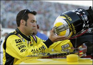 Sam Hornish, Jr., prepares to get in AJ Allmendinger's car as a replacement driver in the NASCAR Sprint Cup Series auto race at Daytona International Speedway, Saturday. Hornish, Jr., finished 33rd.