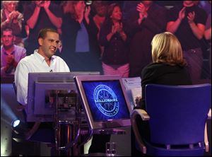 Meredith Vieira, right, host of ‘Who Wants to be a Millionaire’ and
Chad Justen, a Toledo contractor who was on the show in 2008.