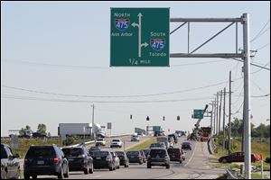 A sign with new graphics, directing motorists onto I-475 at Route 25 in Perrysburg, was installed Wednesday.