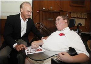 Rocky Bleier, left, served as the keynote speaker for the dinner and auction which honored Parker Inks.

