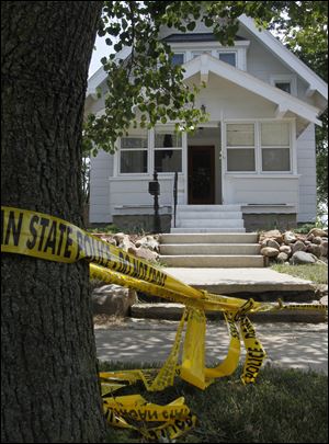 Shortly before midnight Friday, Amy Merrill, 34, and Lisa Gritzmaker, 24, were killed at Ms. Merrill's home at 304 N. Lane St., and their mother, Robin McCowan, was wounded. Neighbors and friends identified the victims.